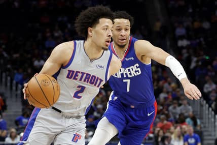 Mar 13, 2022; Detroit, Michigan, USA;  Detroit Pistons guard Cade Cunningham (2) defended by on LA Clippers guard Amir Coffey (7) in the first half at Little Caesars Arena. Mandatory Credit: Rick Osentoski-USA TODAY Sports