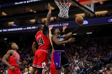 Mar 14, 2022; Sacramento, California, USA; Sacramento Kings guard De'Aaron Fox (5) drives to the basket against Chicago Bulls forward Javonte Green (24) during the second quarter at Golden 1 Center. Mandatory Credit: Sergio Estrada-USA TODAY Sports