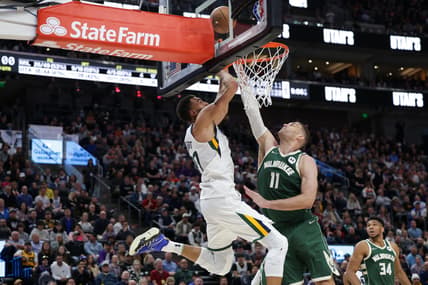 Mar 14, 2022; Salt Lake City, Utah, USA;  Milwaukee Bucks center Brook Lopez (11) tries to block the shot of Utah Jazz center Rudy Gobert (27) during the second quarter at Vivint Arena. Mandatory Credit: Chris Nicoll-USA TODAY Sports