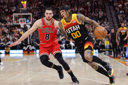 Mar 16, 2022; Salt Lake City, Utah, USA;  Utah Jazz guard Jordan Clarkson (00) tries to get away from Chicago Bulls guard Zach LaVine (8) during the second quarter at Vivint Arena. Mandatory Credit: Chris Nicoll-USA TODAY Sports