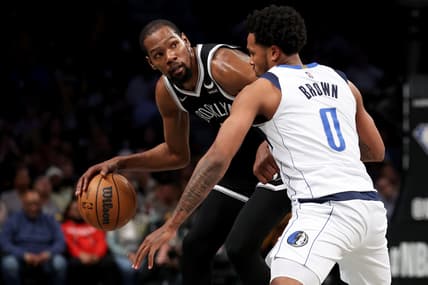 Mar 16, 2022; Brooklyn, New York, USA; Brooklyn Nets forward Kevin Durant (7) controls the ball against Dallas Mavericks forward Sterling Brown (0) during the third quarter at Barclays Center. Mandatory Credit: Brad Penner-USA TODAY Sports