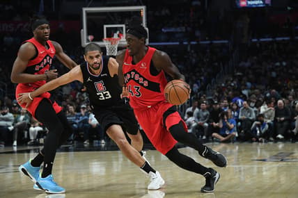 Mar 16, 2022; Los Angeles, California, USA; Toronto Raptors forward Pascal Siakam (43) moves the ball as forward Precious Achiuwa (5) provides coverage against Los Angeles Clippers forward Nicolas Batum (33) during the second half at Crypto.com Arena. Mandatory Credit: Richard Mackson-USA TODAY Sports