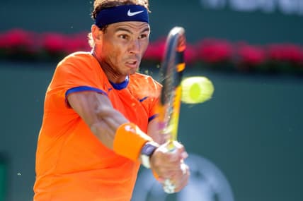 Rafael Nadal of Spain hits a return to Nick Kyrigios of Australia during their quarterfinal match at the BNP Paribas Open in Indian Wells, Calif., on Thursday, March 17, 2022.

Bnp Paribas Open Rafael Nadal Vs Nick Kyrigios540