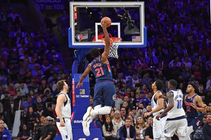 Mar 18, 2022; Philadelphia, Pennsylvania, USA; Philadelphia 76ers center Joel Embiid (21) slam dunks against the Dallas Mavericks during the second quarter at Wells Fargo Center. Mandatory Credit: Eric Hartline-USA TODAY Sports