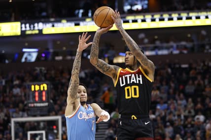 Mar 18, 2022; Salt Lake City, Utah, USA; Utah Jazz guard Jordan Clarkson (00) shoots over LA Clippers guard Amir Coffey (7) in the second quarter at Vivint Arena. Mandatory Credit: Jeffrey Swinger-USA TODAY Sports
