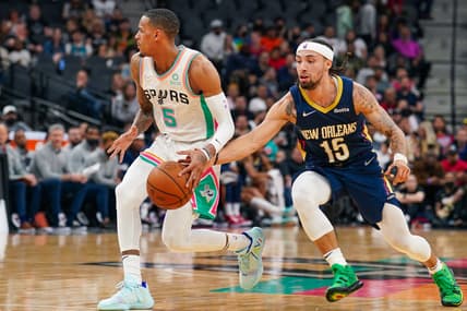 Mar 18, 2022; San Antonio, Texas, USA;  New Orleans Pelicans guard Jose Alvarado (15) knocks the ball away from San Antonio Spurs guard Dejounte Murray (5) in the second half at the AT&T Center. Mandatory Credit: Daniel Dunn-USA TODAY Sports