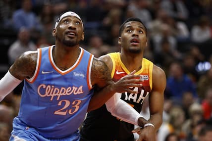 Mar 18, 2022; Salt Lake City, Utah, USA; LA Clippers forward Robert Covington (23) and Utah Jazz guard Jared Butler (13) battle for position in the second quarter at Vivint Arena. Mandatory Credit: Jeffrey Swinger-USA TODAY Sports