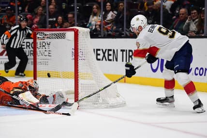 Mar 18, 2022; Anaheim, California, USA; Anaheim Ducks goaltender John Gibson (36) blocks a shot against Florida Panthers center Sam Bennett (9) during the third period at Honda Center. Mandatory Credit: Gary A. Vasquez-USA TODAY Sports