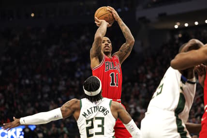 Mar 22, 2022; Milwaukee, Wisconsin, USA;  Chicago Bulls guard DeMar DeRozan (11) shoots over Milwaukee Bucks guard Wesley Matthews (23) during the second quarter at Fiserv Forum. Mandatory Credit: Jeff Hanisch-USA TODAY Sports