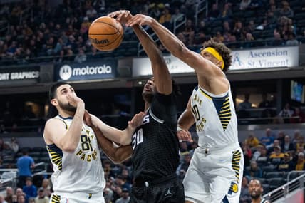 Mar 23, 2022; Indianapolis, Indiana, USA; Indiana Pacers center Goga Bitadze (88) and forward Justin Anderson (10) fight for a rebound with Sacramento Kings center Damian Jones (30) in the first half at Gainbridge Fieldhouse. Mandatory Credit: Trevor Ruszkowski-USA TODAY Sports