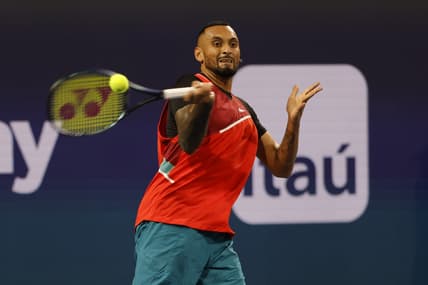 Mar 23, 2022; Miami Gardens, FL, USA; Nick Kyrgios (AUS) hits a forehand against Adrian Mannarino (FRA) (not pictured) in a first round men's singles match in the Miami Open at Hard Rock Stadium. Mandatory Credit: Geoff Burke-USA TODAY Sports