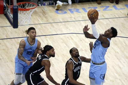 Mar 23, 2022; Memphis, Tennessee, USA; Memphis Grizzlies forward Jaren Jackson Jr. (13) shoots as Brooklyn Nets forward Kevin Durant (7) defends during the second half at FedExForum. Mandatory Credit: Petre Thomas-USA TODAY Sports