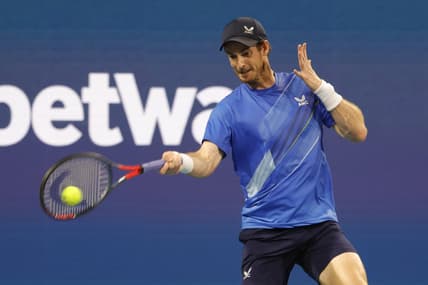 Mar 24, 2022; Miami Gardens, FL, USA; Andy Murray (GBR) hits a forehand against Federico Delbonis (ARG) (not pictured) in a first round men's singles match in the Miami Open at Hard Rock Stadium. Mandatory Credit: Geoff Burke-USA TODAY Sports