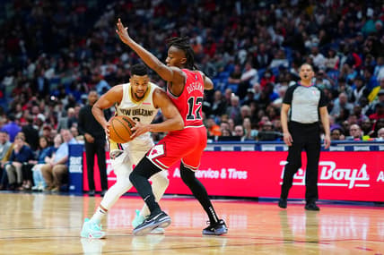 Mar 24, 2022; New Orleans, Louisiana, USA; New Orleans Pelicans guard CJ McCollum (3) fights for position against Chicago Bulls guard Ayo Dosunmu (12) during the second quarter at Smoothie King Center. Mandatory Credit: Andrew Wevers-USA TODAY Sports