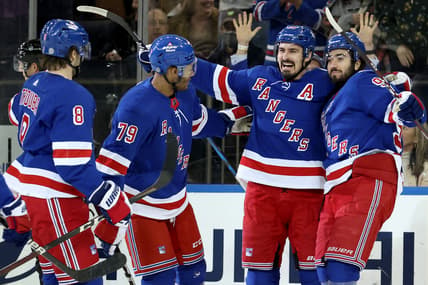 Mar 25, 2022; New York, New York, USA; New York Rangers left wing Chris Kreider (20) celebrates his goal against the Pittsburgh Penguins with defenseman Jacob Trouba (8) and defenseman K'Andre Miller (79) and center Mika Zibanejad (93) during the first period at Madison Square Garden. Mandatory Credit: Brad Penner-USA TODAY Sports