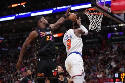 Mar 25, 2022; Miami, Florida, USA; Miami Heat forward Jimmy Butler (22) blocks the shot of New York Knicks guard RJ Barrett (9) during the second half at FTX Arena. Mandatory Credit: Jasen Vinlove-USA TODAY Sports