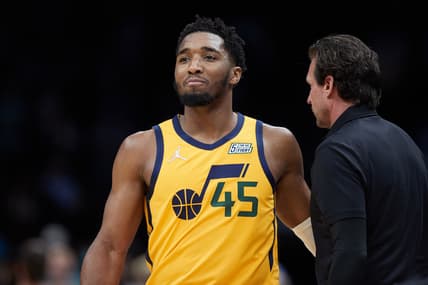 Mar 25, 2022; Charlotte, North Carolina, USA; Utah Jazz guard Donovan Mitchell (45) walks past head coach Quin Snyder during the fourth quarter against the Charlotte Hornets at Spectrum Center. Mandatory Credit: Brian Westerholt-USA TODAY Sports