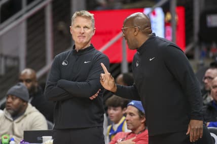 Mar 25, 2022; Atlanta, Georgia, USA; Golden State Warriors head coach Steve Kerr talks to assistant coach Mike Brown against the Atlanta Hawks in the second half at State Farm Arena. Mandatory Credit: Brett Davis-USA TODAY Sports