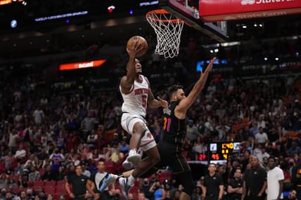 Mar 25, 2022; Miami, Florida, USA; New York Knicks guard Immanuel Quickley (5) puts up a shot over Miami Heat guard Max Strus (31) during the second half at FTX Arena. Mandatory Credit: Jasen Vinlove-USA TODAY Sports
