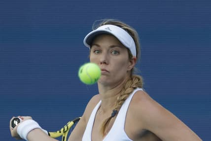 Mar 26, 2022; Miami Gardens, FL, USA; Danielle Collins (USA) follows the ball while hitting a forehand against Vera Zvonareva (not pictured) in a third round women's singles match in the Miami Open at Hard Rock Stadium. Mandatory Credit: Geoff Burke-USA TODAY Sports