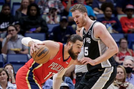 Mar 26, 2022; New Orleans, Louisiana, USA;  New Orleans Pelicans center Jonas Valanciunas (17) controls the ball against San Antonio Spurs center Jakob Poeltl (25) during the first half at the New Orleans Pelicans at the Smoothie King Center. Mandatory Credit: Stephen Lew-USA TODAY Sports