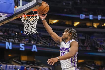 Mar 26, 2022; Orlando, Florida, USA; Sacramento Kings guard Davion Mitchell (15) goes to the basket during the second quarter against the Orlando Magic at Amway Center. Mandatory Credit: Mike Watters-USA TODAY Sports