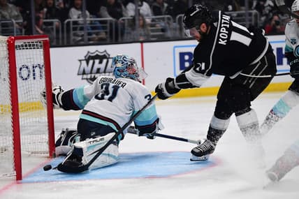 Mar 26, 2022; Los Angeles, California, USA; Los Angeles Kings center Anze Kopitar (11) scores a goal against Seattle Kraken goaltender Philipp Grubauer (31) during the second period at Crypto.com Arena. Mandatory Credit: Gary A. Vasquez-USA TODAY Sports