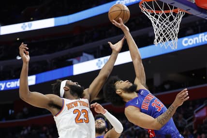Mar 27, 2022; Detroit, Michigan, USA;  New York Knicks center Mitchell Robinson (23) and Detroit Pistons forward Marvin Bagley III (35) goes for the rebound in the first half at Little Caesars Arena. Mandatory Credit: Rick Osentoski-USA TODAY Sports