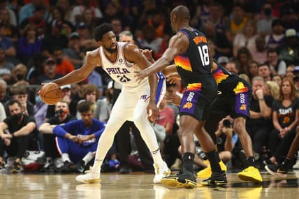 Mar 27, 2022; Phoenix, Arizona, USA; Philadelphia 76ers center Joel Embiid (21) moves the ball against Phoenix Suns center Bismack Biyombo (18) during the first half at Footprint Center. Mandatory Credit: Mark J. Rebilas-USA TODAY Sports