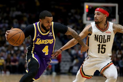 Mar 27, 2022; New Orleans, Louisiana, USA; Los Angeles Lakers guard D.J. Augustin (4) drives on New Orleans Pelicans guard Jose Alvarado (15) in the second quarter at the Smoothie King Center. Mandatory Credit: Chuck Cook-USA TODAY Sports