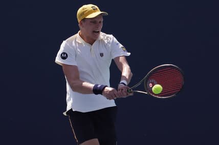 Mar 28, 2022; Miami Gardens, FL, USA; Jenson Brooksby (USA) hits a backhand against Roberto Bautista Agut (ESP)(not pictured) in a third round men's singles match in the Miami Open at Hard Rock Stadium. Mandatory Credit: Geoff Burke-USA TODAY Sports