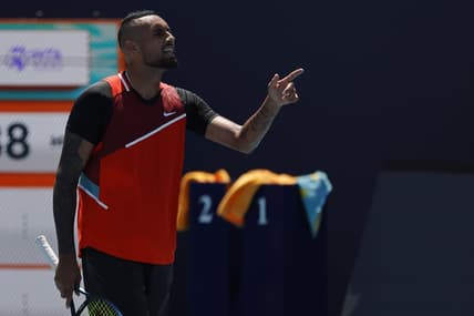 Mar 29, 2022; Miami Gardens, FL, USA; Nick Kyrgios (AUS) argues with chair umpire Carlos Bernardes (not pictured) after being assessed a point penalty during the first set tiebreaker against Jannik Sinner (ITA)(not pictured) in a fourth round men's singles match in the Miami Open at Hard Rock Stadium. Mandatory Credit: Geoff Burke-USA TODAY Sports