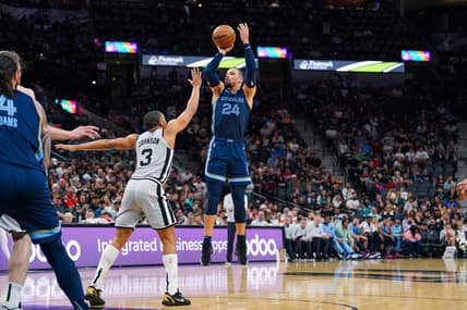 Mar 30, 2022; San Antonio, Texas, USA; Memphis Grizzlies forward Dillon Brooks (24) shoots over San Antonio Spurs forward Keldon Johnson (3) in the first half at the AT&T Center. Mandatory Credit: Daniel Dunn-USA TODAY Sports