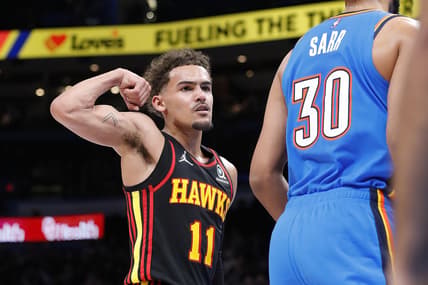 Mar 30, 2022; Oklahoma City, Oklahoma, USA; Atlanta Hawks guard Trae Young (11) gestures towards Oklahoma City Thunder center Olivier Sarr (30) after scoring a basket during the first half at Paycom Center. Mandatory Credit: Alonzo Adams-USA TODAY Sports
