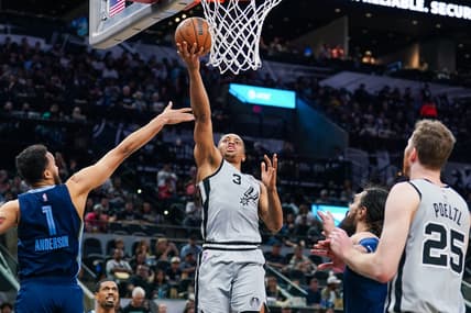 Mar 30, 2022; San Antonio, Texas, USA; San Antonio Spurs forward Keldon Johnson (3) shoots in the second half against the Memphis Grizzlies at the AT&T Center. Mandatory Credit: Daniel Dunn-USA TODAY Sports