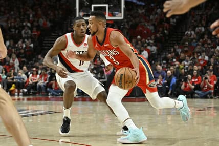 Mar 30, 2022; Portland, Oregon, USA; New Orleans Pelicans guard CJ McCollum (3) drives to the basket during the first half against Portland Trail Blazers guard Kris Dunn (18) at Moda Center. Mandatory Credit: Troy Wayrynen-USA TODAY Sports