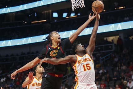 Mar 31, 2022; Atlanta, Georgia, USA; Cleveland Cavaliers center Moses Brown (6) and Atlanta Hawks center Clint Capela (15) go up for a rebound in the first quarter at State Farm Arena. Mandatory Credit: Brett Davis-USA TODAY Sports