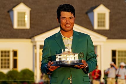 Apr 11, 2021; Augusta, Georgia, USA; Hideki Matsuyama celebrates with The Masters trophy after winning The Masters golf tournament. Mandatory Credit: Rob Schumacher-USA TODAY Sports