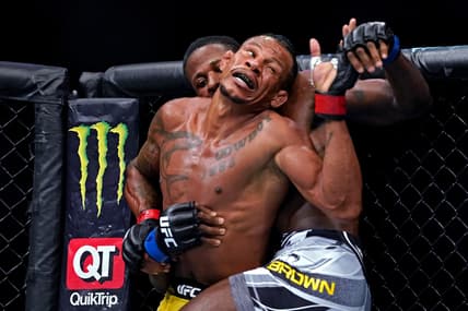 Apr 24, 2021; Jacksonville, Florida, USA; Alex Oliveira (Red Gloves) fights Randy Brown (Blue Gloves) during UFC 261 at VyStar Veterans Memorial Arena. Mandatory Credit: Jasen Vinlove-USA TODAY Sports