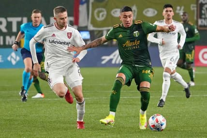Dec 4, 2021; Portland, Oregon, USA; Portland Timbers midfielder Marvin Loria (44) dribbles the ball as Real Salt Lake defender Andrew Brody (2) gives chase during the second half during the Western Conference Finals of the 2021 MLS Playoffs at Providence Park. Mandatory Credit: Kirby Lee-USA TODAY Sports