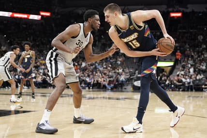 Dec 11, 2021; San Antonio, Texas, USA; Denver Nuggets center Nikola Jokic (15) prepares to drive to the basket while defended by San Antonio Spurs forward Thaddeus Young (30) during the second half at AT&T Center. Mandatory Credit: Scott Wachter-USA TODAY Sports