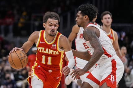 Dec 13, 2021; Atlanta, Georgia, USA; Atlanta Hawks guard Trae Young (11) moves the ball against Houston Rockets guard Armoni Brooks (7) during the second half at State Farm Arena. Mandatory Credit: Dale Zanine-USA TODAY Sports