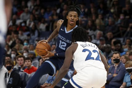 Jan 13, 2022; Memphis, Tennessee, USA; Memphis Grizzles guard Ja Morant (12) looks for an open lane during the second half against the Minnesota Timberwolves at FedExForum. Mandatory Credit: Petre Thomas-USA TODAY Sports