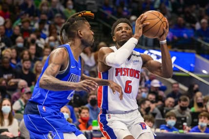 Feb 8, 2022; Dallas, Texas, USA; Dallas Mavericks forward Reggie Bullock (25) guards Detroit Pistons guard Hamidou Diallo (6) during the second half at the American Airlines Center. Mandatory Credit: Jerome Miron-USA TODAY Sports