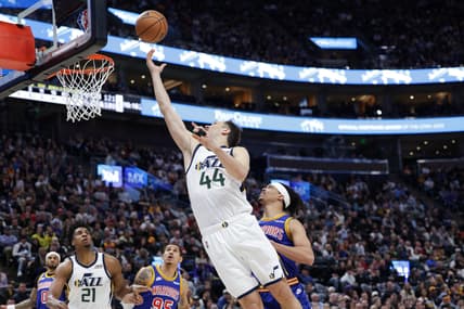 Feb 9, 2022; Salt Lake City, Utah, USA;  Utah Jazz forward Bojan Bogdanovic (44) jumps past Golden State Warriors guard Damion Lee (1) and pushes the ball to the basket during the fourth quarter at Vivint Arena. Utah Jazz won 111-85. Mandatory Credit: Chris Nicoll-USA TODAY Sports