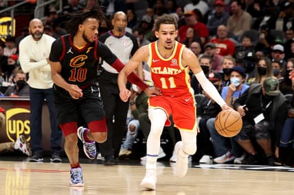 Feb 15, 2022; Atlanta, Georgia, USA; Atlanta Hawks guard Trae Young (11) drives against Cleveland Cavaliers guard Darius Garland (10) during the second half at State Farm Arena. Mandatory Credit: Jason Getz-USA TODAY Sports