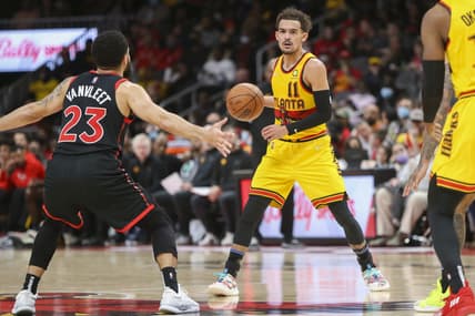 Feb 26, 2022; Atlanta, Georgia, USA; Atlanta Hawks guard Trae Young (11) is defended by Toronto Raptors guard Fred VanVleet (23) in the second half at State Farm Arena. Mandatory Credit: Brett Davis-USA TODAY Sports