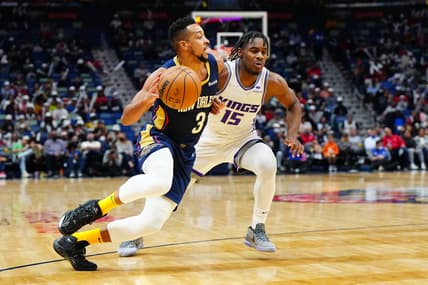 Mar 2, 2022; New Orleans, Louisiana, USA; New Orleans Pelicans guard CJ McCollum (3) drives to the basket against Sacramento Kings guard Davion Mitchell (15) during the third quarter at Smoothie King Center. Mandatory Credit: Andrew Wevers-USA TODAY Sports