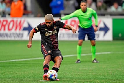 Mar 13, 2022; Atlanta, Georgia, USA; Atlanta United forward Josef Martinez (7) scores on a penalty kick against Charlotte FC during the second half at Mercedes-Benz Stadium. Atlanta United won 2-1. Mandatory Credit: Dale Zanine-USA TODAY Sports