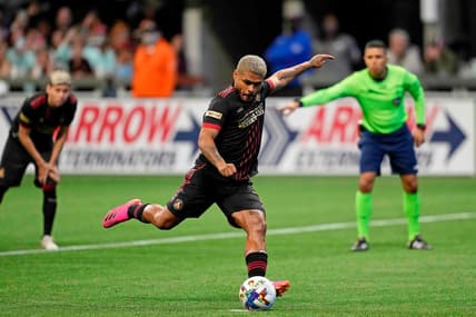 Mar 13, 2022; Atlanta, Georgia, USA; Atlanta United forward Josef Martinez (7) scores on a penalty kick against Charlotte FC during the second half at Mercedes-Benz Stadium. Atlanta United won 2-1. Mandatory Credit: Dale Zanine-USA TODAY Sports